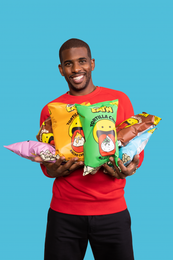 Chris Paul Holding Good Eatn Bags Blue Background